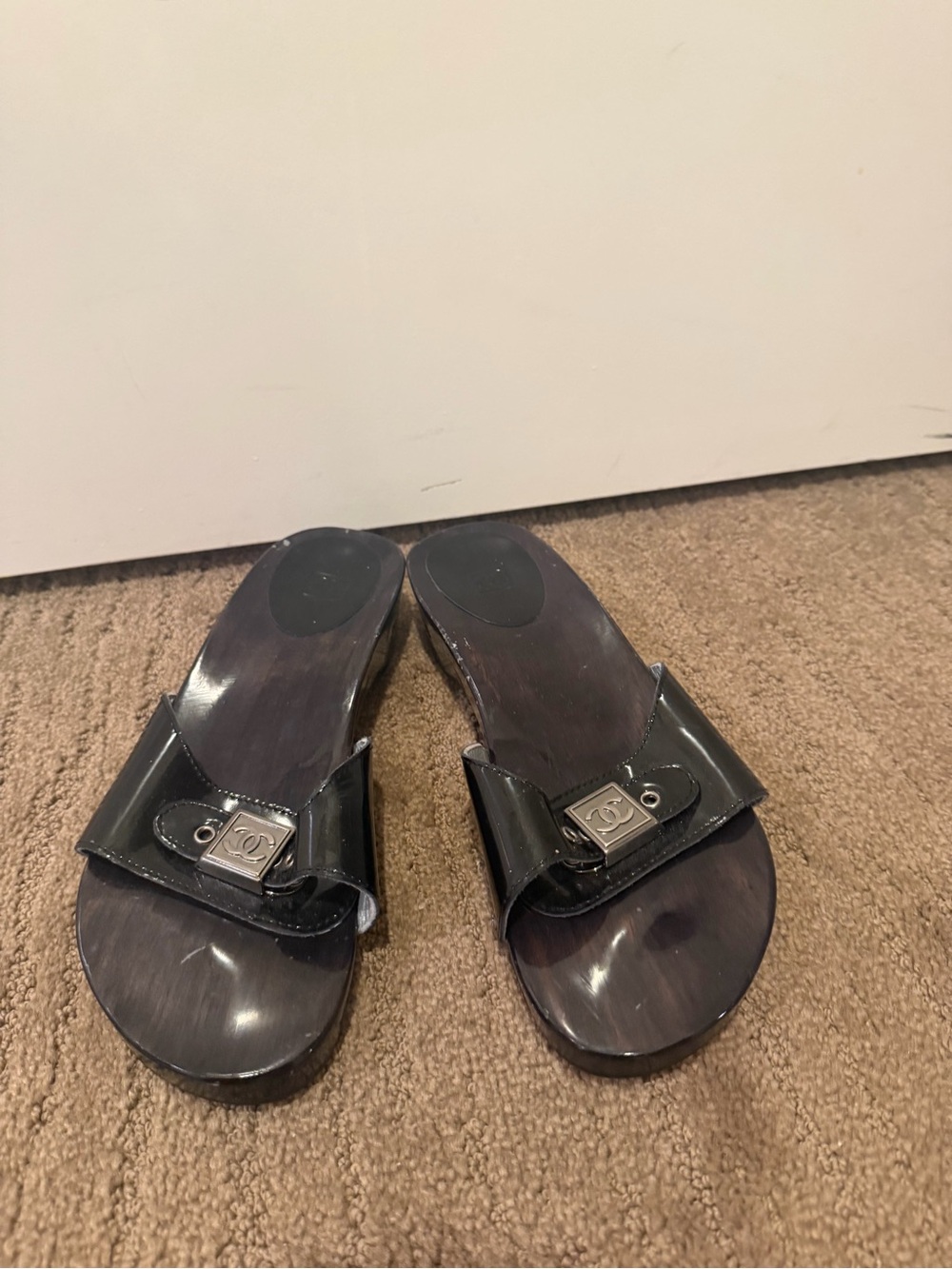 CHANEL Black Patent Leather Slide Mules with Silver Logo Plaque